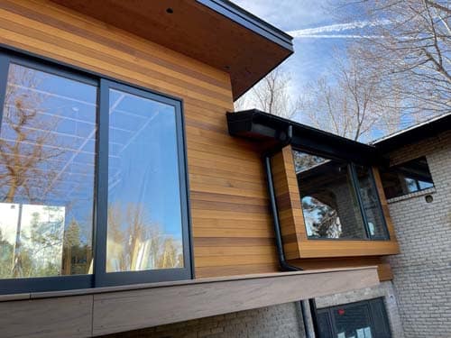 This Boulder house renovation included clear cedar siding and wood siding installation.