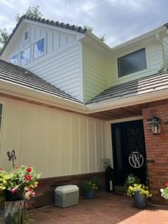 Home siding in traditional horizontal plank and board and batten siding